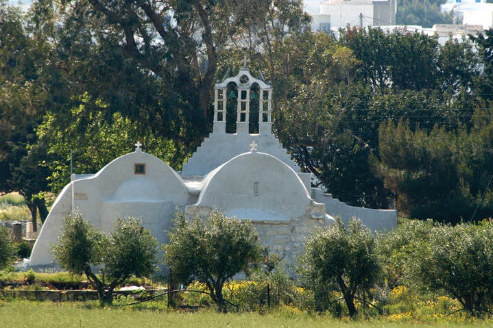 White chapel surrounded by greenery